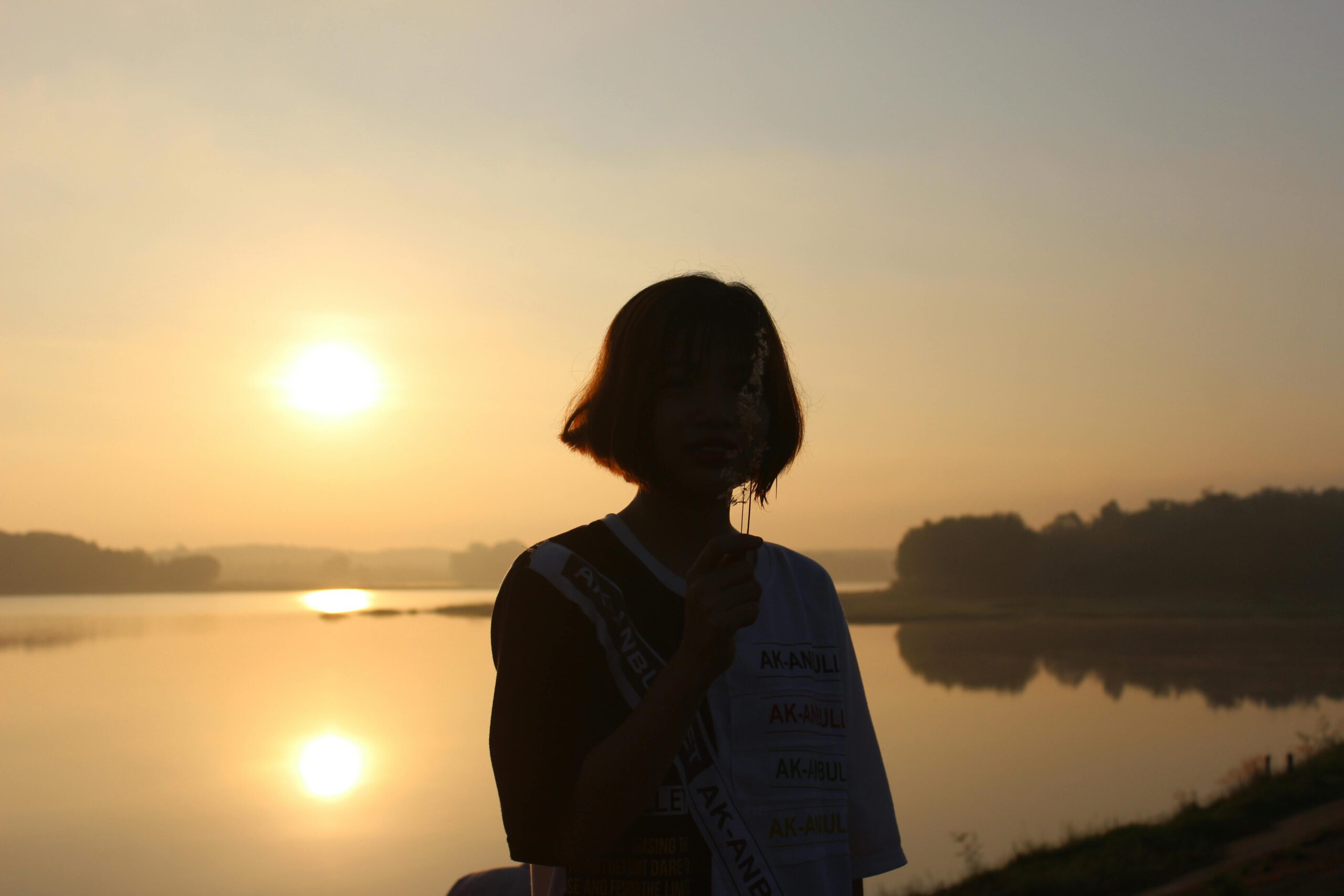 Woman looking over mountains at sunrise